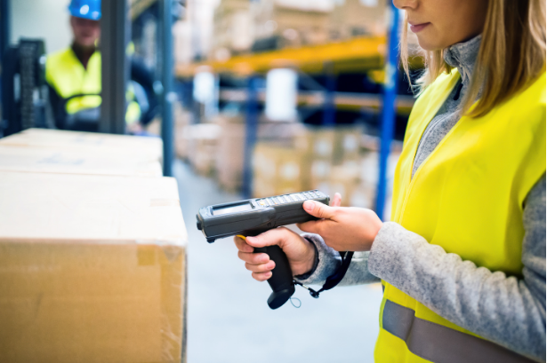 Scanning a box to track orders going through the warehouse